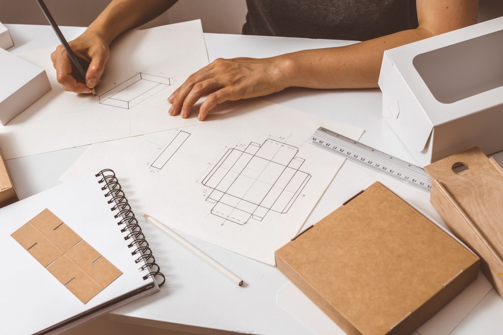 designer-draws-paper-packaging-1-1024x683.jpg